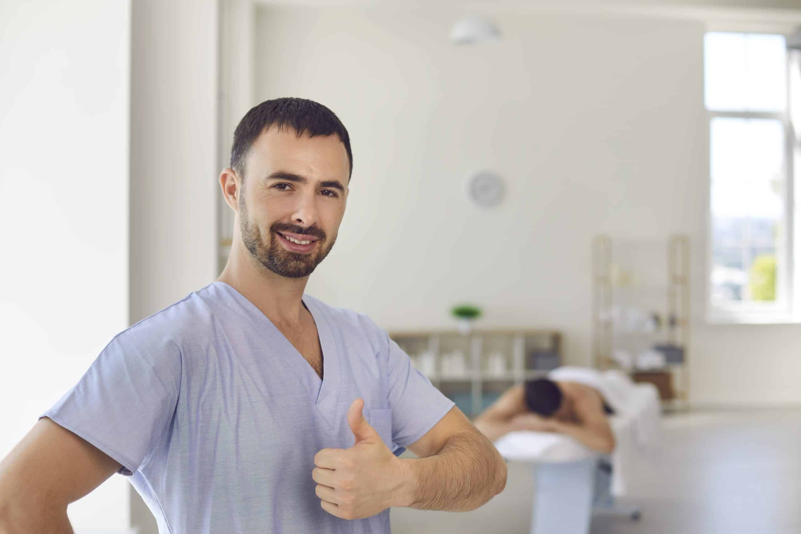 Smiling man doctor chiropractor